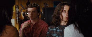 Movie still from “Scream 4” (2011), directed by Wes Craven – Two men sitting next to each other in front of a computer screen; Medium shot, Over the shoulder angle