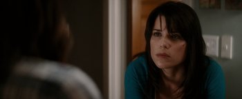 Movie still from “Scream 4” (2011), directed by Wes Craven – A person sitting in front of a mirror; Close Up shot, Over the shoulder angle