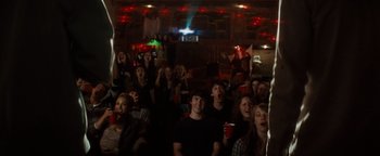 Movie still from “Scream 4” (2011), directed by Wes Craven – A group of people sitting in a room watching a movie; Wide shot, High angle