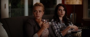 Movie still from “Scream 4” (2011), directed by Wes Craven – Two women sitting on a couch holding a drink; Close Up shot, Over the shoulder angle