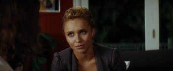 Movie still from “Scream 4” (2011), directed by Wes Craven – A person wearing a suit; Close Up shot, Over the shoulder angle