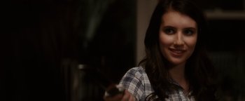 Movie still from “Scream 4” (2011), directed by Wes Craven – A woman holding a remote control in her hand; Close Up shot, Over the shoulder angle