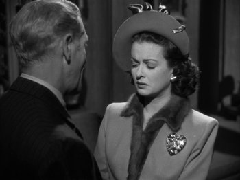 Movie still from “Secret Beyond the Door...” (1947), directed by Fritz Lang – An old photo of a man and a woman talking to each other; Close Up shot, Over the shoulder angle