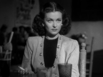 Movie still from “Secret Beyond the Door...” (1947), directed by Fritz Lang – An old black and white photo of a woman; Close Up shot, Over the shoulder angle