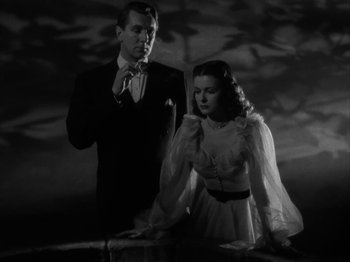 Movie still from “Secret Beyond the Door...” (1947), directed by Fritz Lang – A man and a woman standing next to each other; Medium shot, Low angle