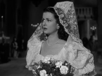 Movie still from “Secret Beyond the Door...” (1947), directed by Fritz Lang – A black and white photo of a woman in a wedding dress; Close Up shot, High angle