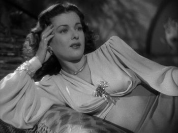 Movie still from “Secret Beyond the Door...” (1947), directed by Fritz Lang – An old black and white photo of a woman; Close Up shot, Low angle