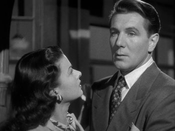 Movie still from “Secret Beyond the Door...” (1947), directed by Fritz Lang – A man and a woman standing next to each other; Close Up shot, Low angle