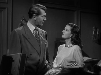 Movie still from “Secret Beyond the Door...” (1947), directed by Fritz Lang – A man and a woman standing next to each other in a room; Medium shot, Low angle