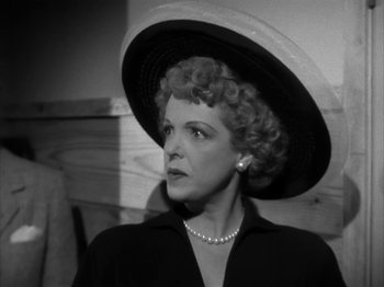 Movie still from “Secret Beyond the Door...” (1947), directed by Fritz Lang – An old photo of a woman wearing a large hat; Close Up shot, Low angle