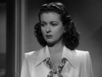 Movie still from “Secret Beyond the Door...” (1947), directed by Fritz Lang – A black - and - white photo of a woman in a dress; Close Up shot, Low angle