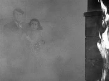 Movie still from “Secret Beyond the Door...” (1947), directed by Fritz Lang – A man and a woman standing next to each other in the fog; Wide shot, High angle