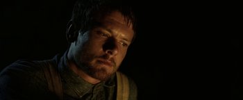 Movie still from “Godless” (2017), directed by Scott Frank – A person with a beard looking at the camera; Close Up shot, Low angle