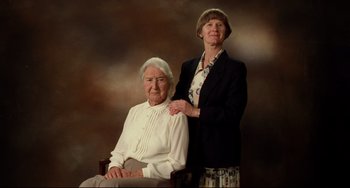 Movie still from “Secrets & Lies” (1996), directed by Mike Leigh – An older woman standing next to a younger woman; Medium shot, Low angle