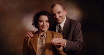 Movie still from “Secrets & Lies” (1996), directed by Mike Leigh – A man and a woman posing for a picture; Close Up shot, Low angle