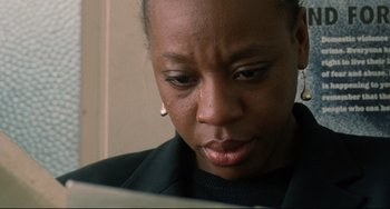 Movie still from “Secrets & Lies” (1996), directed by Mike Leigh – A person looking at a computer screen; Close Up shot, High angle