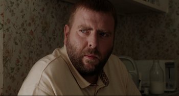 Movie still from “Secrets & Lies” (1996), directed by Mike Leigh – A person wearing a tie; Close Up shot, Low angle