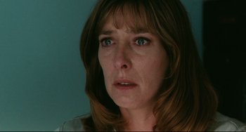 Movie still from “Secrets & Lies” (1996), directed by Mike Leigh – A person with a sad look on their face; Close Up shot, Low angle