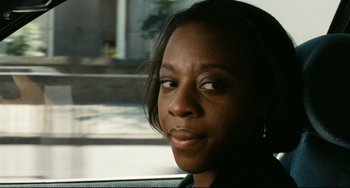 Movie still from “Secrets & Lies” (1996), directed by Mike Leigh – A person sitting in a car; Close Up shot, High angle