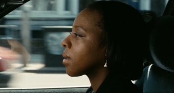 Movie still from “Secrets & Lies” (1996), directed by Mike Leigh – A woman sitting in a car looking out the window; Close Up shot, Low angle