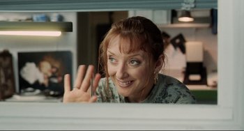 Movie still from “Secrets & Lies” (1996), directed by Mike Leigh – A person looking through a window; Close Up shot, Over the shoulder angle