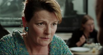 Movie still from “Secrets & Lies” (1996), directed by Mike Leigh – A person wearing a blue sweater; Close Up shot, Over the shoulder angle