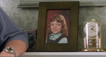 Movie still from “Secrets & Lies” (1996), directed by Mike Leigh – A picture of a young girl in a picture frame; Close Up shot, High angle