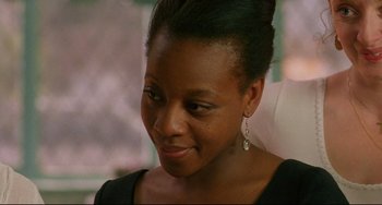 Movie still from “Secrets & Lies” (1996), directed by Mike Leigh – A person wearing a black shirt; Close Up shot, Over the shoulder angle