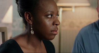 Movie still from “Secrets & Lies” (1996), directed by Mike Leigh – A person wearing a black shirt; Close Up shot, Over the shoulder angle