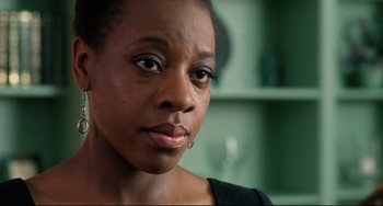 Movie still from “Secrets & Lies” (1996), directed by Mike Leigh – A person looking at the camera; Close Up shot, Low angle