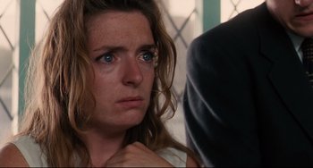 Movie still from “Secrets & Lies” (1996), directed by Mike Leigh – A person with blue eyes; Close Up shot, Over the shoulder angle