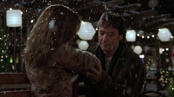 Movie still from “Serendipity” (2001), directed by Peter Chelsom – A man and a woman in the snow; Medium shot, Over the shoulder angle