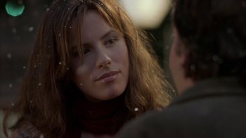Movie still from “Serendipity” (2001), directed by Peter Chelsom – A person looking at the camera; Close Up shot, Over the shoulder angle