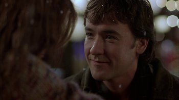 Movie still from “Serendipity” (2001), directed by Peter Chelsom – A man's face as a woman looks on; Close Up shot, Over the shoulder angle