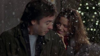 Movie still from “Serendipity” (2001), directed by Peter Chelsom – A man and a woman standing next to each other in the snow; Close Up shot, Over the shoulder angle