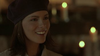 Movie still from “Serendipity” (2001), directed by Peter Chelsom – A person wearing a hat; Close Up shot, Over the shoulder angle