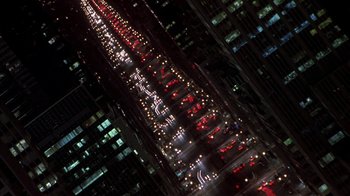Movie still from “Serendipity” (2001), directed by Peter Chelsom – An aerial view of a city street at night; Extreme Wide shot, Overhead angle
