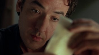 Movie still from “Serendipity” (2001), directed by Peter Chelsom – A person holding a cell phone; Close Up shot, Low angle