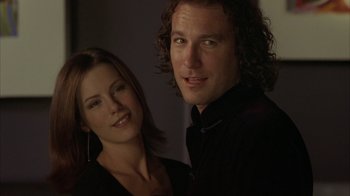 Movie still from “Serendipity” (2001), directed by Peter Chelsom – A man and a woman posing for a picture; Close Up shot, Low angle