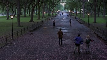 Movie still from “Serendipity” (2001), directed by Peter Chelsom – People are walking down a path in a park; Extreme Wide shot, High angle