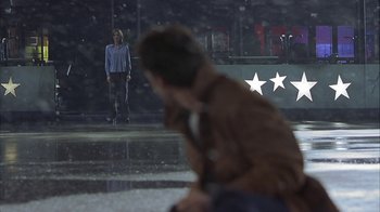 Movie still from “Serendipity” (2001), directed by Peter Chelsom – A man and a woman standing in front of a building; Wide shot, Over the shoulder angle