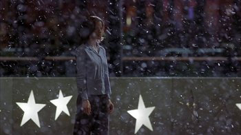 Movie still from “Serendipity” (2001), directed by Peter Chelsom – A woman standing in front of a snow covered wall; Wide shot, Over the shoulder angle