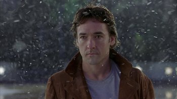 Movie still from “Serendipity” (2001), directed by Peter Chelsom – A person wearing a jacket; Close Up shot, Low angle