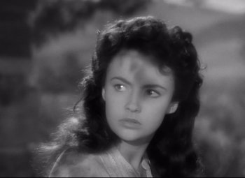 Movie still from “Sergeant York” (1941), directed by Howard Hawks – A black - and - white photo of a young woman with long hair; Close Up shot, Over the shoulder angle