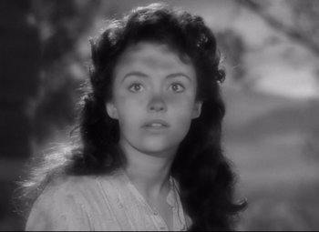 Movie still from “Sergeant York” (1941), directed by Howard Hawks – A black - and - white photo of a young woman with long hair; Close Up shot, High angle