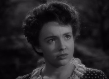 Movie still from “Sergeant York” (1941), directed by Howard Hawks – An old photo of a woman looking at the camera; Close Up shot, High angle