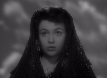 Movie still from “Sergeant York” (1941), directed by Howard Hawks – A black and white photo of a woman wearing a black veil; Close Up shot, Low angle