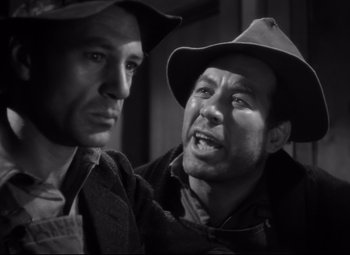 Movie still from “Sergeant York” (1941), directed by Howard Hawks – A black and white photo of two men wearing hats; Close Up shot, Low angle