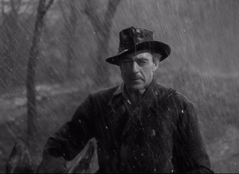 Movie still from “Sergeant York” (1941), directed by Howard Hawks – A black and white photo of a man in the rain; Close Up shot, Low angle