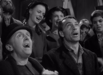 Movie still from “Sergeant York” (1941), directed by Howard Hawks – A group of people that are standing in a room together; Medium shot, Low angle